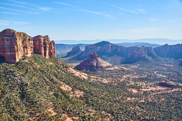 Aerial View of Sedona Red Rock Cliffs and Buttes Against Blue Sky