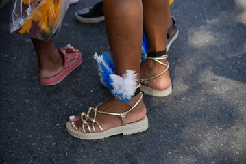 Naklejka premium Passers-by dressed in costume are seen during the Fuzue pre-carnival performance in the city of Salvador, Brazil