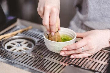 person holding tea cup