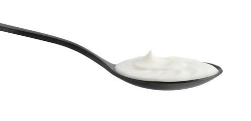 One black spoon with sour cream isolated on white