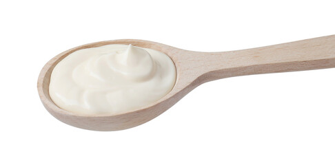 One wooden spoon with mayonnaise isolated on white