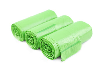Rolls of light green garbage bags isolated on white