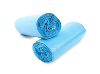 Two rolls of light blue garbage bags isolated on white