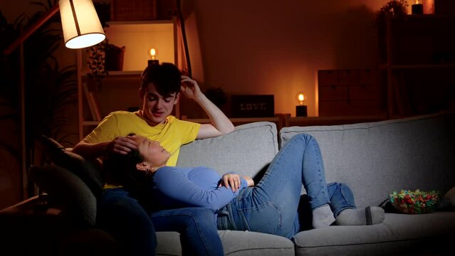 Teenager couple being caught by surprise flirting at home. Privacy and intimacy concept.