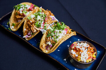 Vibrant Mexican Tacos and Elote on Dark Background