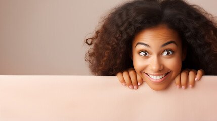 Creative portrait of young african woman with pink background. Copy space for text.