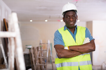 Portrait of confident african-american foreman in a room being renovated