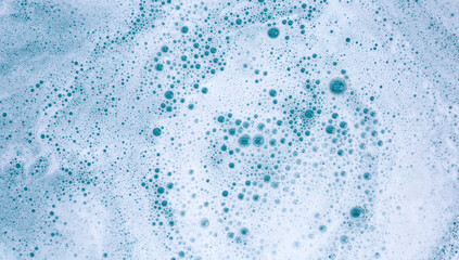 Detergent foam bubble on water. Blue background, Soap sud