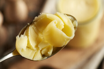 Clarified butter or ghee on a spoon