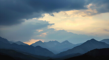 Fototapeta premium The fading light creating a dramatic contrast between the mountains and the sky.