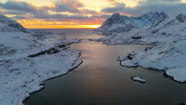 norway lofoten islands fjords and bridges covered with snow with sunset colors