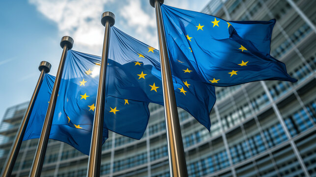 European flags in front of the Berlaymont building, headquarters of the European Commission in Brussels, Belgium