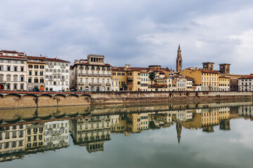 Fototapeta na wymiar Embankment of Arno River in Florence, Italy