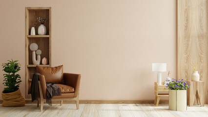 Living room wall mockup with leather armchair and decor on cream color wall background