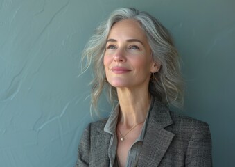 Middle aged businesswoman, happy smiling female boss, wearing suit
