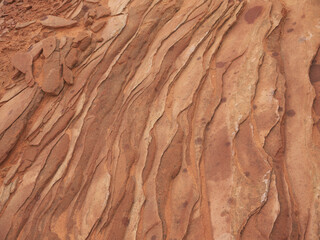 Arizona desert landscape texture, close up view, Martian red ground rock strata, layered sandstone rock formation 