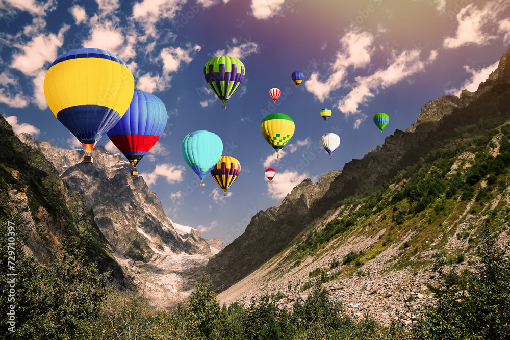 Wall mural Bright hot air balloons flying over mountains