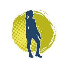 Silhouette of a woman fighter in pose carrying hand gun or pistol glock weapon.