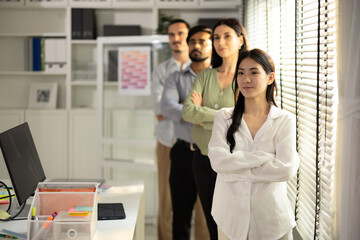 Obraz premium A diverse startup team expresses confidence and collaboration in a&nbsp;modern office environment..
