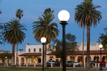 Twilight street light framed view of historic structures in downtown Ajo, Arizona, USA.