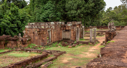 Fototapeta na wymiar Red brick and stone temple ruin building complex structure in Pre Rup temple pagoda Angkor Wat historical park in the green forest of Siem Reap Cambodia