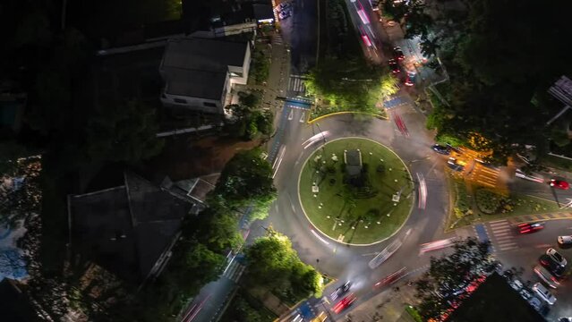 Aerial Fast Orbit Hyperlapse of Roundabout Traffic at Night. Ciudad Jardin. Cali, Colombia