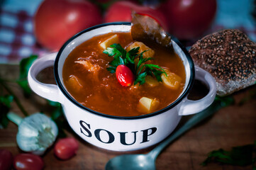 hearty homemade soup in a  bowl on the wooden table