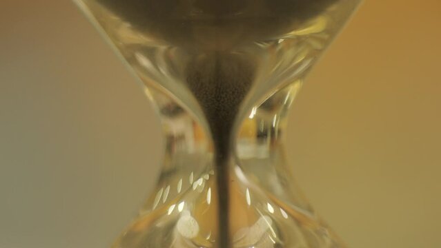 Macro close up video of sand timer running down