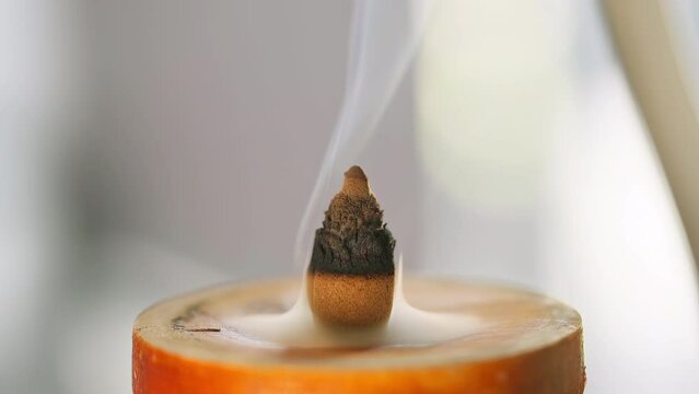Close-Up of Flower Bud-Shaped Agarwood Incense Burning, Unveiling a Delicate Dance of Gentle Smoke