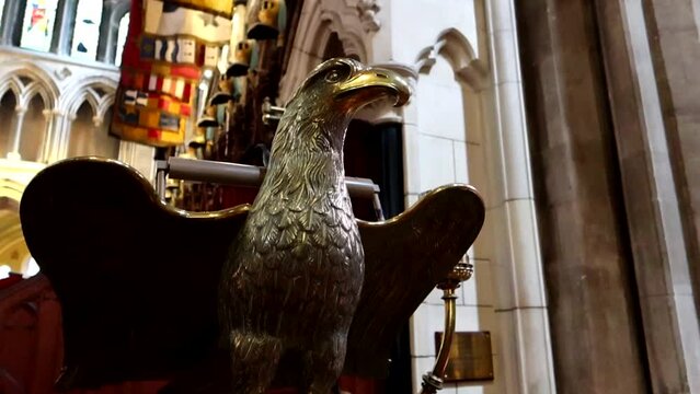 Low angle shot of a golden eagle statue inside of St Patrick's Cathedral, Dublin, Ireland
