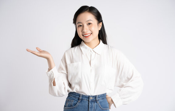Portrait of young Asian businesswoman posing on white background