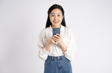 Portrait of young Asian businesswoman using phone on white background