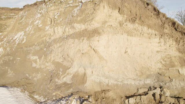 Sandstone Cliff Covered By Snow And Natural Erosion Work - Aerial Drone Shot