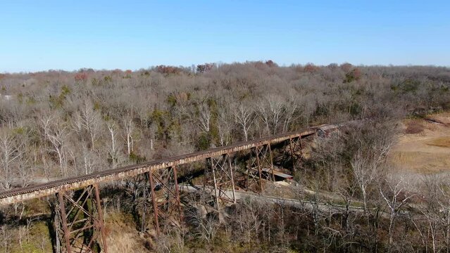 Aerial Shot Orbiting the Pope Lick Railroad Trestle in Louisville Kentucky on a Bright, Sunny Afternoon.