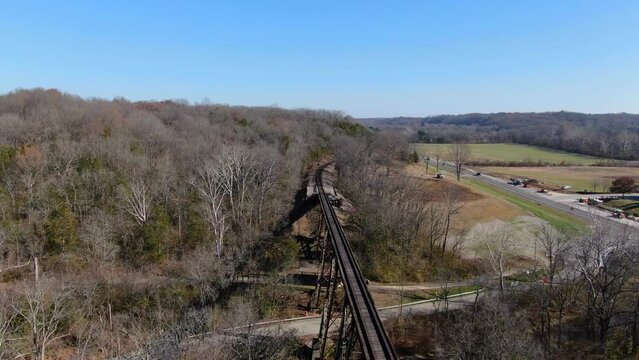 Aerial Shot Pushing Towards the End of the Pope Lick Railroad Trestle in Louisville Kentucky on a Sunny Afternoon