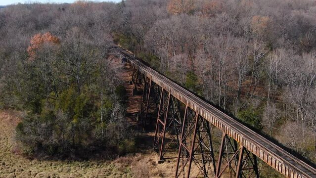 Tight Aerial Shot Of Train Tracks Running off the Pope Lick Trestle and into the Woods in Louisville Kentucky