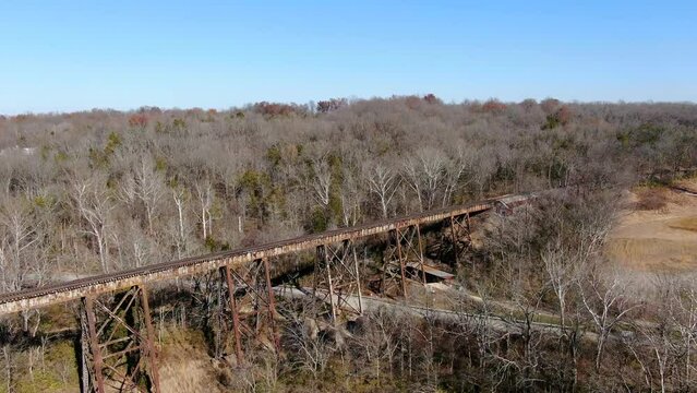 Aerial Shot Orbiting the Pope Lick Railroad Trestle in Louisville Kentucky on a Bright, Sunny Afternoon