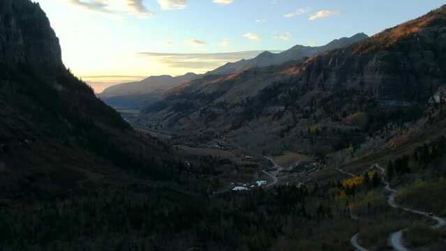 Telluride Colorado aerial drone  4wd off roading historic town scenic landscape autumn golden yellow Aspen trees  sunset Rocky Mountains Silverton Ouray Millon Dollar Highway slowly forward motion