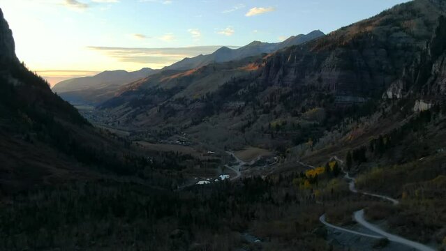 Telluride Colorado aerial drone  4wd off roading historic town scenic landscape autumn golden yellow Aspen trees  sunset Rocky Mountains Silverton Ouray Millon Dollar Highway slowly forward reveal up
