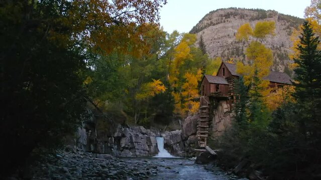 Colorado Crystal Mill historic landmark waterfall Crystal River Marble sunset autumn fall aerial drone cinematic golden hour Carbondale Telluride Aspen Pitkin Gunnison county backwards slowly motion