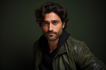 Portrait of a handsome man in a leather jacket. Men's beauty, fashion.