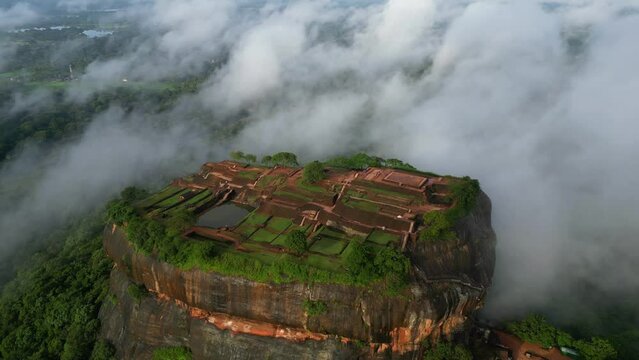 Aerial view over Sigiriya or Lion Rock in Sri Lanka in clouds. An ancient fortress rock landmark