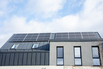 Fototapeta premium solar panels on rooftop modern village