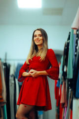 Woman Wearing a Mini Red Dress with Bell Sleeves. Attractive millennial girl trying on a romantic outfit in a fashion store 
