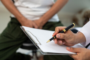 A man consults a doctor about prostate enlargement and pain from frequent urination. A young man...