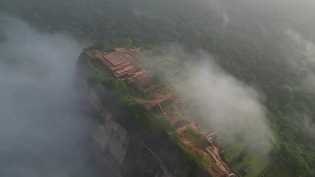 Aerial view over Sigiriya or Lion Rock in Sri Lanka in clouds. An ancient fortress rock landmark