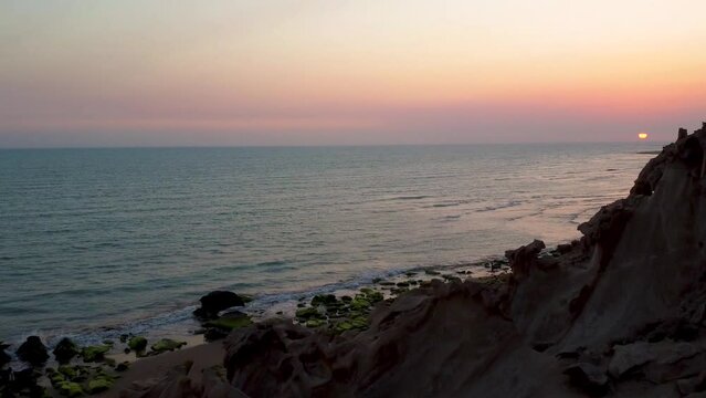 Dragon beach wind polished erosion on rock cliff mountain mud clay material natural formation yardang landform coastal tropical desert climate harbor the scenic wonderful wide view of sea ocean Iran