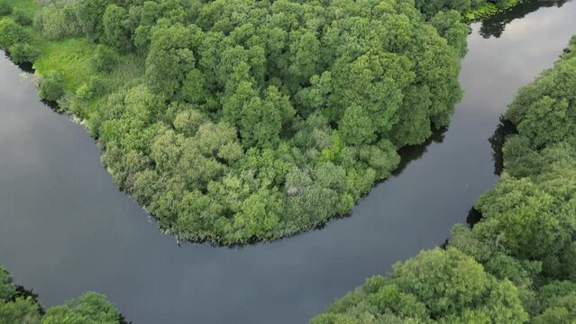 Drone recording of Guden&aring;, where the drone reverses slowly across the stream.