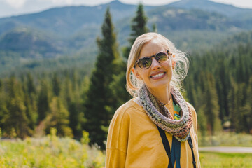 Beautiful young woman hiking a mountain trail in the Lamar Valley of Yellowstone National Park
