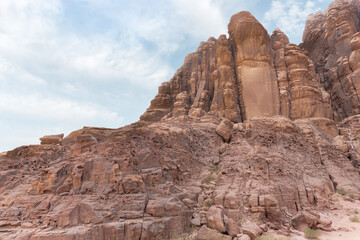 Bizarre shapes of high mountains in red desert of Wadi Rum near Amman in Jordan